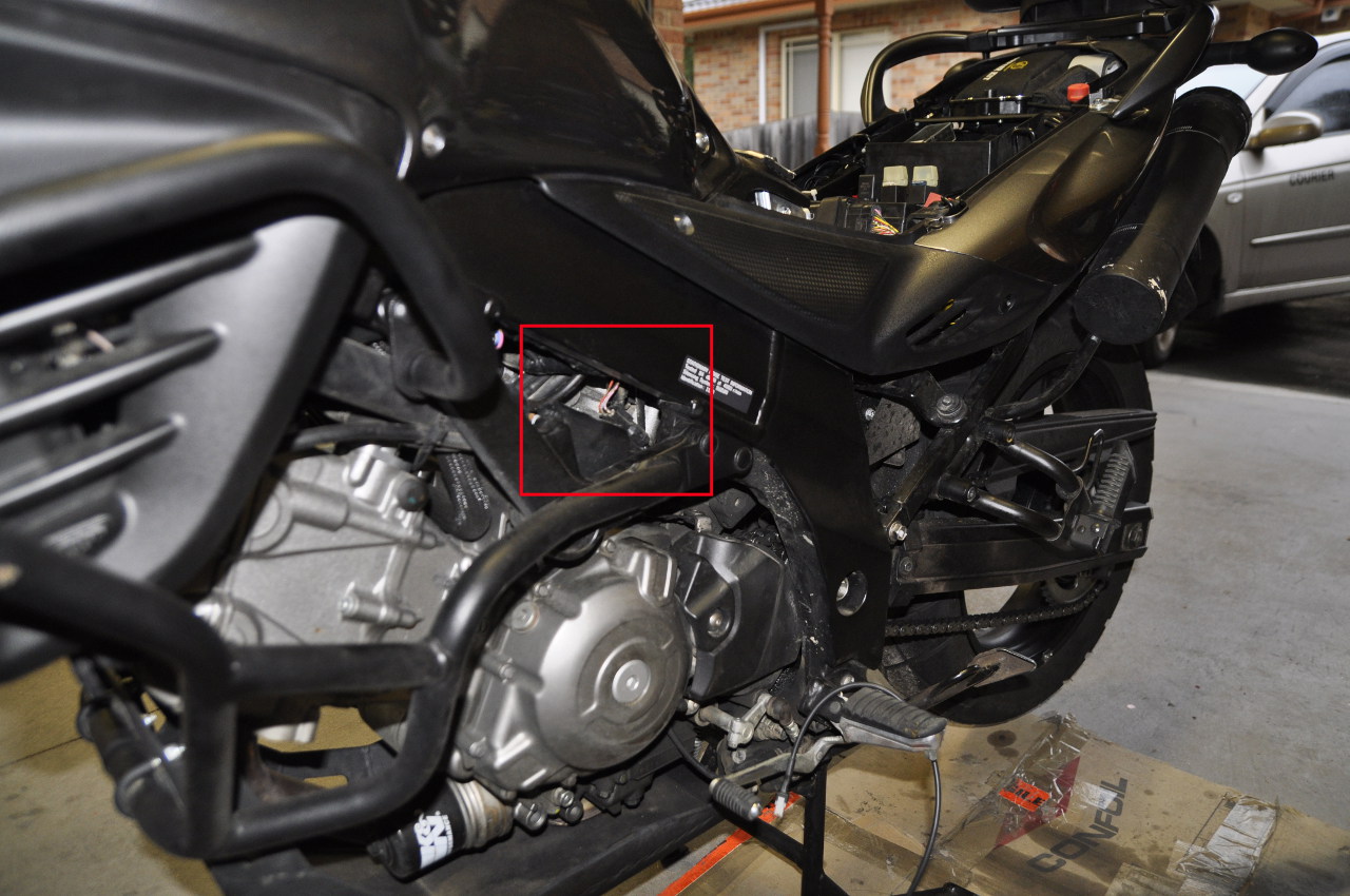 Find the cable on the left side of the bike.